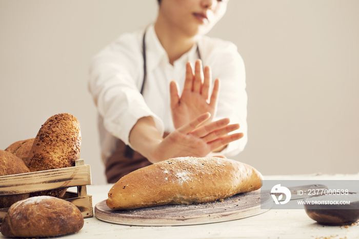 Woman refusing to eat white bread