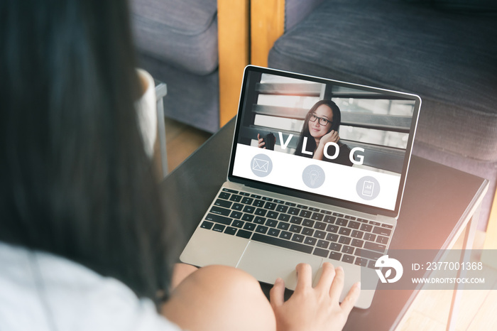 video blog, woman reading vlog online on computer