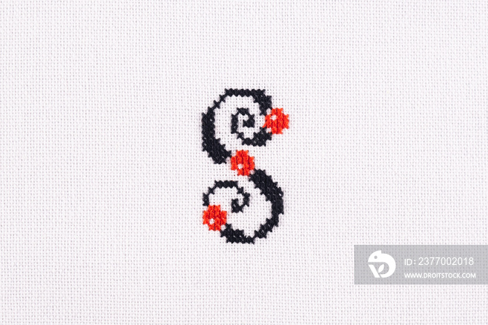 Letter S of Embroidered Cross - Stitch Latin Alphabet on White Linen Fabric Handmade Close-up