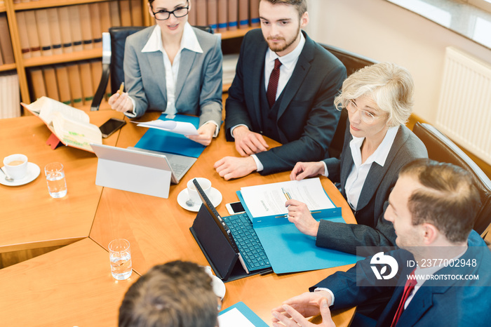 Top view of lawyer teams negotiating an agreement