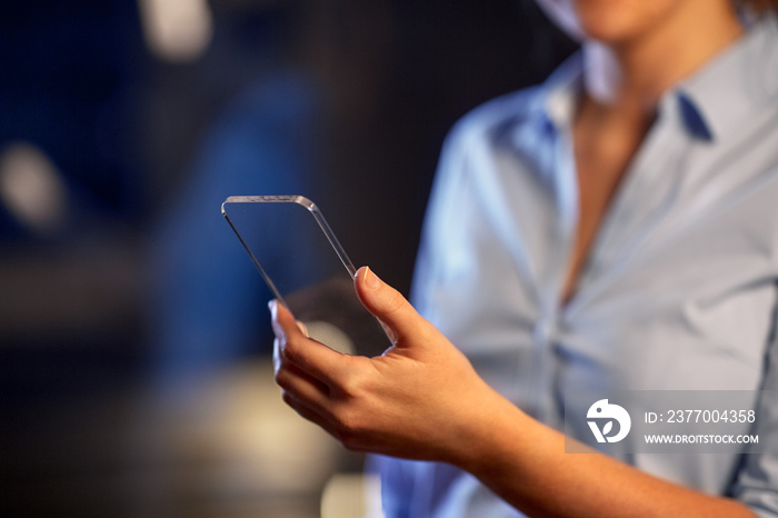 business, people and technology concept - close up of hand with transparent smartphone