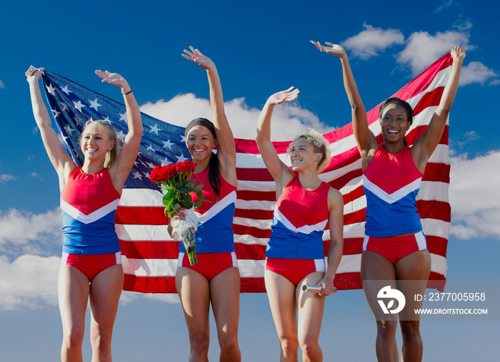 Four American athletes celebrating