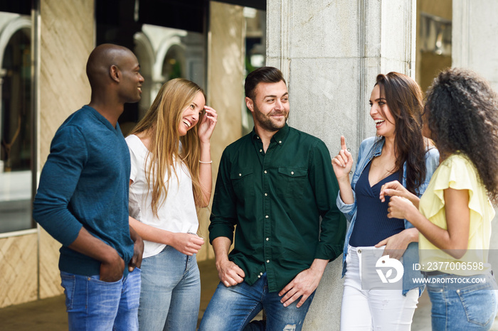 Multi-ethnic group of friends having fun together in urban background