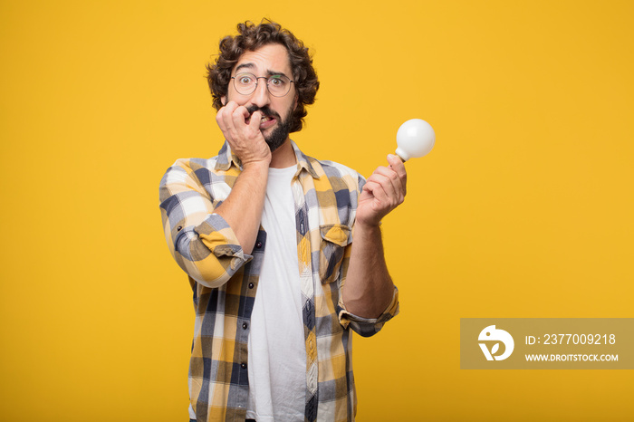 young crazy mad man  fool pose with a light bulb. idea or inspir