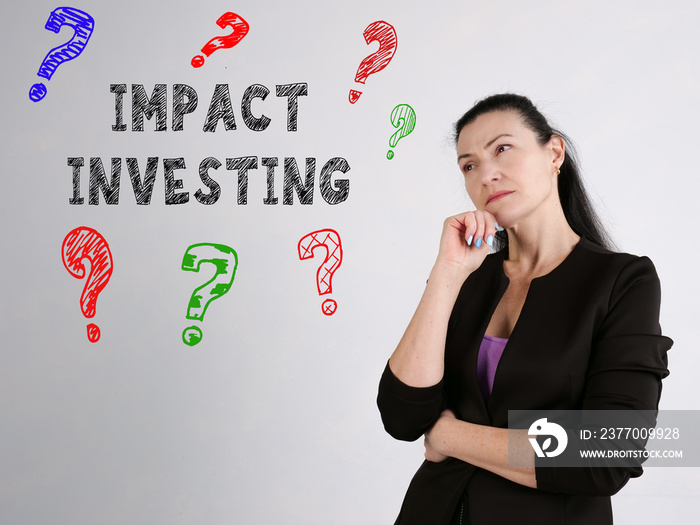 Financial concept meaning IMPACT INVESTING question marks with phrase on the wall