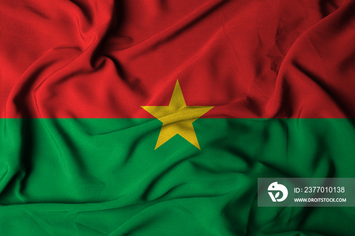 selective focus burkina faso flag, with waving fabric texture. 3D illustration