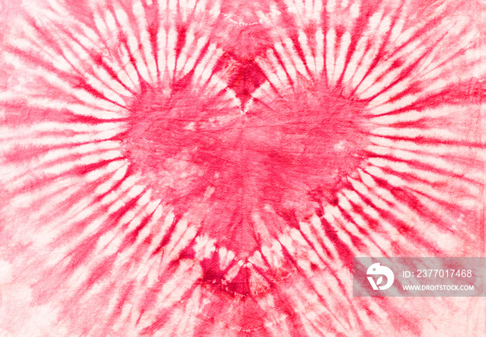 pink heart shape tie dye pattern hand dyed on cotton fabric texture background.