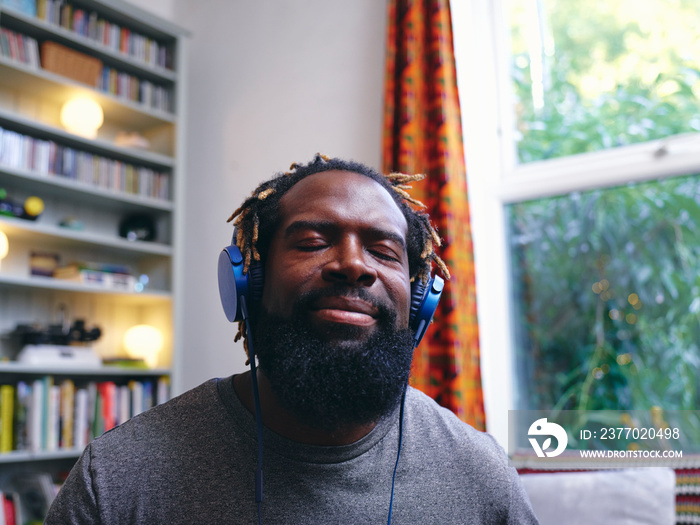 Man listening to music on headphones