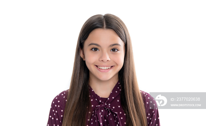 Charming portrait of pretty teen girl. Portrait of cute positive little girl isolated on yellow background. Attractive caucasian child smiling and looking at camera.