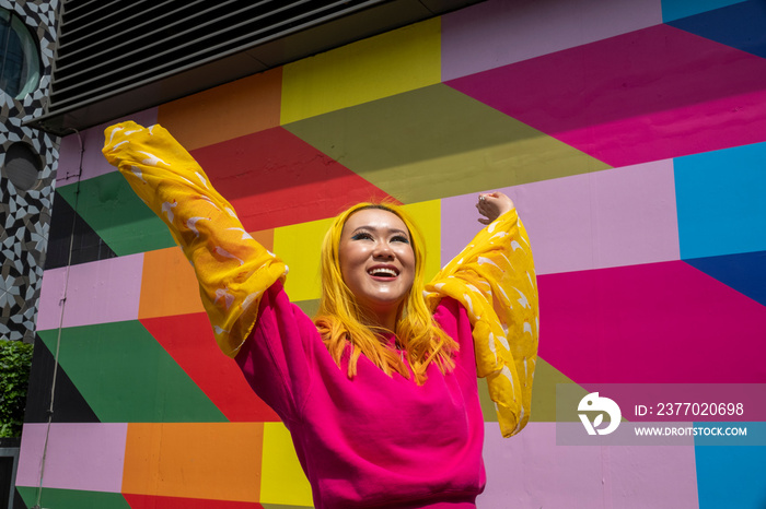 Smiling young woman with yellow hair