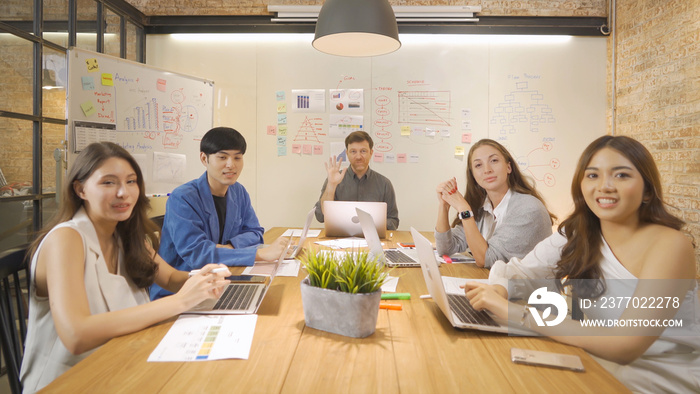 A group of multi ethnic business team talking on video call conference, work in meeting in office in company, present ideas with a computer technology device. People lifestyle. Corporation.