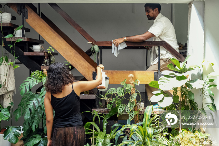 Group of housemates cleaning their home together