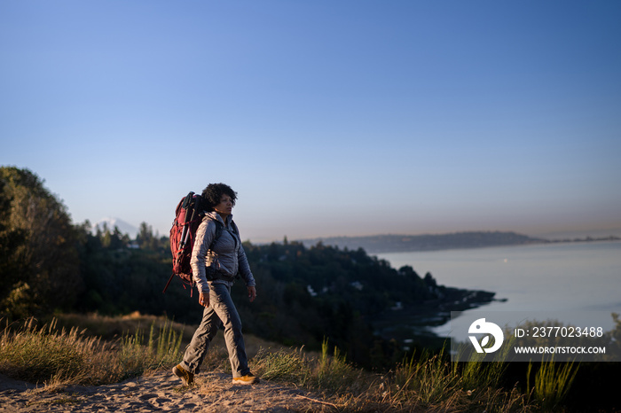 U.S. Army female soldier putting in the miles with an early morning hike in the NorthWest.