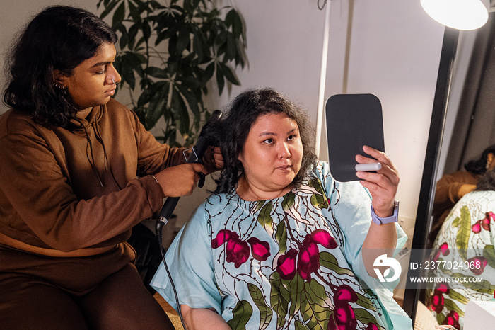 Group of friends doing each others make up at home during a sleepover