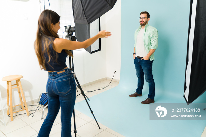 Happy male model posing in the photography studio