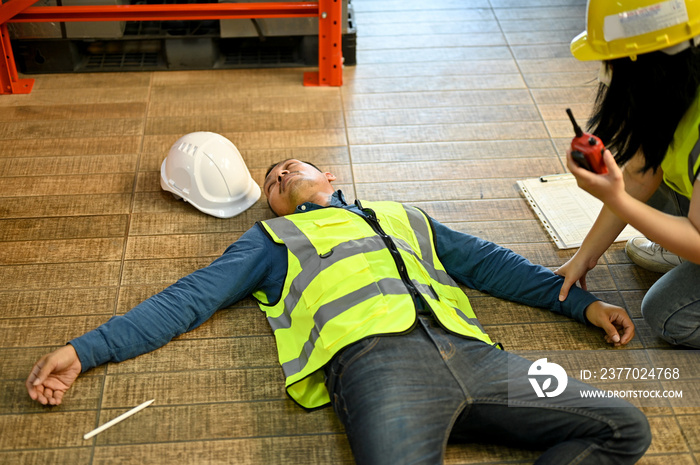 Unconscious man pass out while working in the warehouse, recused by a female colleague.