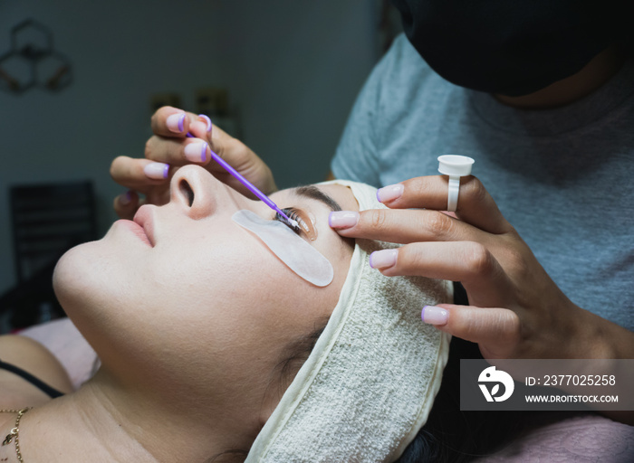 Young woman receiving natural eyelash lift treatment