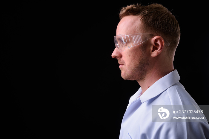 Portrait of handsome blond man doctor as scientist