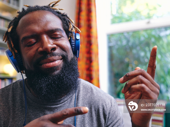 Man listening to music on headphones