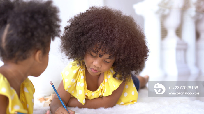 Cute little African student doing schoolwork