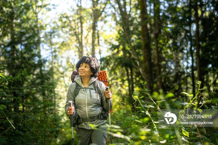 U.S. Army female soldier putting in the miles with an early morning hike in the NorthWest.