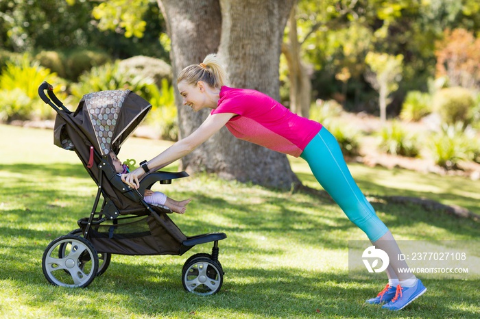 Woman exercising with baby stroller