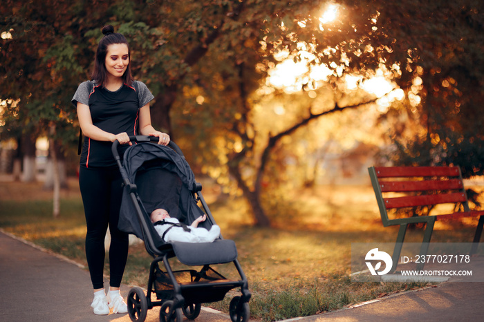 Active Mother Wearing Sporty Outfit Pushing Stroller in the Park