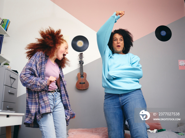 Mother and daughter  dancing in room