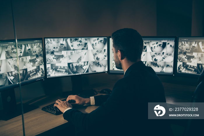 Profile side view portrait of his he nice serious professional man qualified expert safeguard supervising customers online safety remote panel night shift at workplace workstation