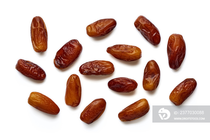 Dry dates isolated on white background. Top view. Flat lay.