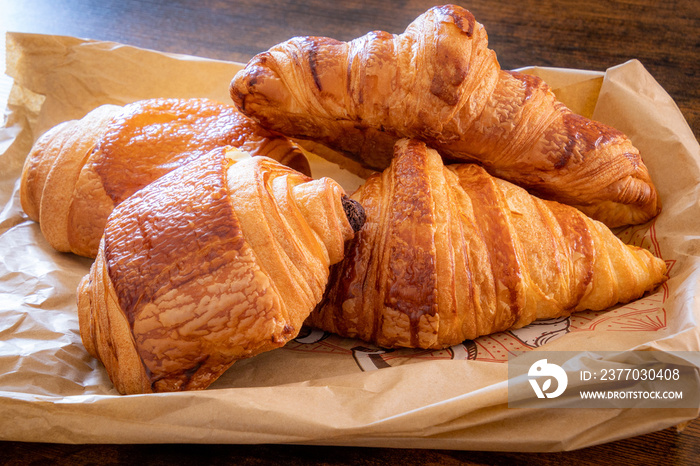 croissant and chocolate bread on a table