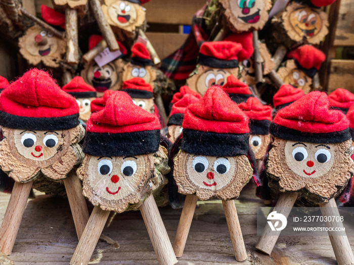 Artisan tio de nadal, a typical christmas character from catalonia, spain, in a christmas market