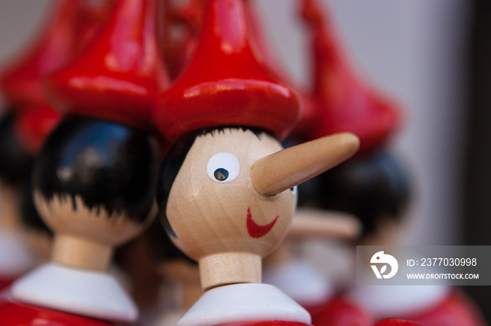 Wooden Pinocchio’s figurines sold as souvenirs in Gubbio, Umbria, Italy