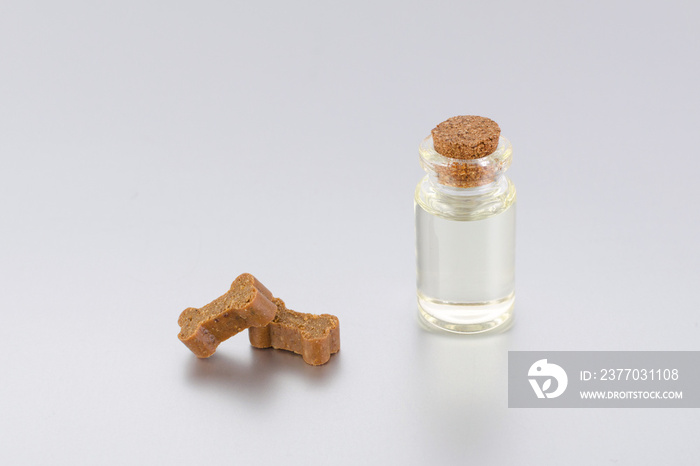 natural supplement oil for pets with treats like bones