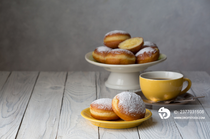 Bombolone - filled sweet yeast dough deep-fried, with a cream. Italian carnival  doughnuts. Copy space.