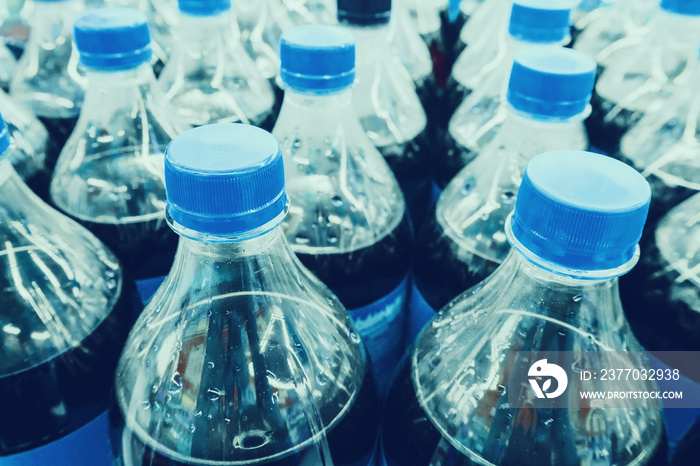 Carbonated soft drink bottles close up