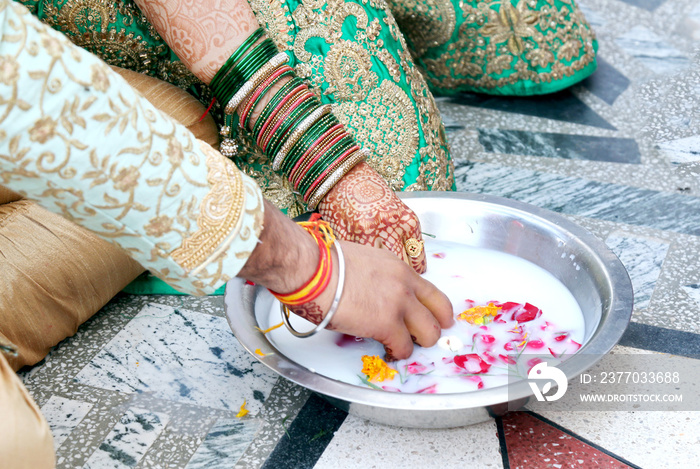 Indian couple playing Ring Fishing game in wedding ceremony of India