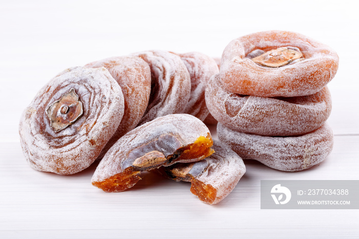 Dried flattened persimmon fruits