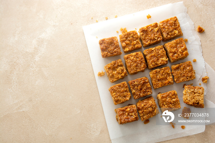 Energy bites, fudges oatmeal healthy snack, square cookies, top view