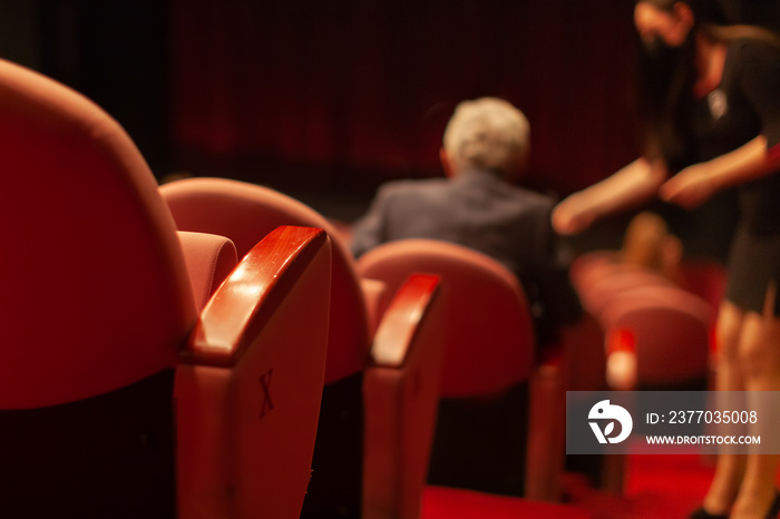 audience taking a seat before performance