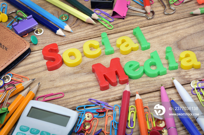 Social Media word and office tools on wooden table