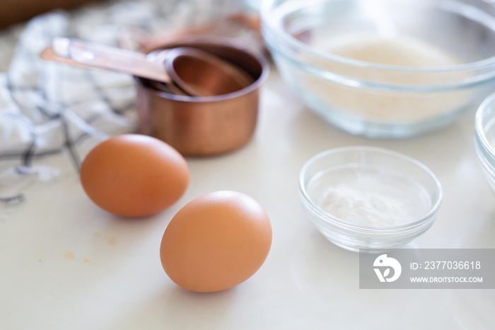 Cake ingredients, eggs, sugar, and  baking soda