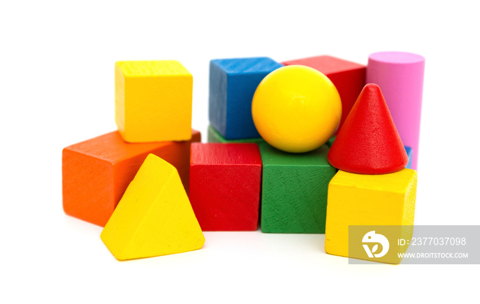 different color and shape wooden toy blocks on white background