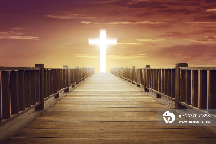 Shine cross shape in the end of wooden path