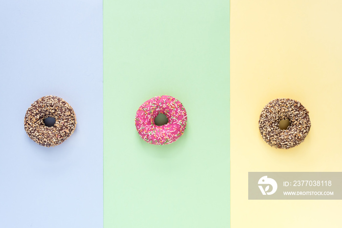 Colorfull Donuts with Icing on Colorfull Background Top View Three Tasty Donuts Horizontal