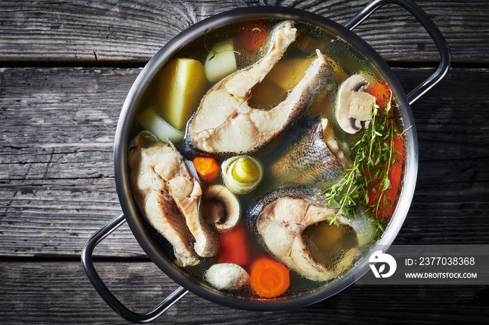 spicy Trout fish soup in a metal pot