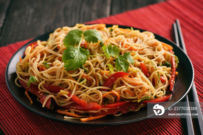 Asian salad with rice noodles and vegetables, korean style cuisine.