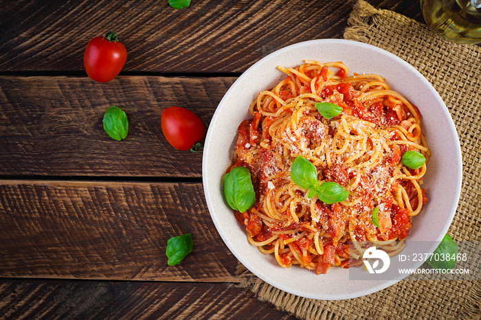 Spaghetti alla Amatriciana with guanciale, tomatoes and pecorino cheese. Italian healthy food. Top view, flat lay