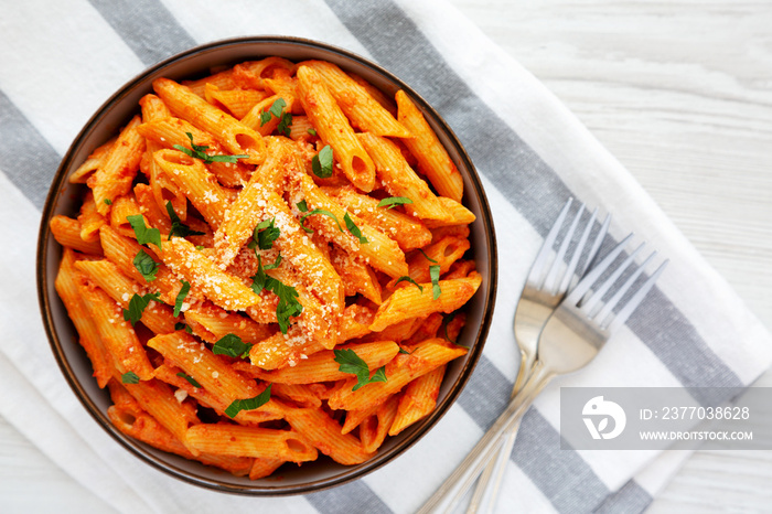 Homemade Penne Alla Vodka from Leftover Sauce with Cheese and Parsley, top view. Overhead, from above, flat lay.