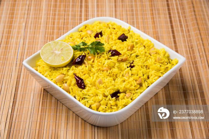 rice with lemon, curry leaf and red chilly in the bowl, close-up